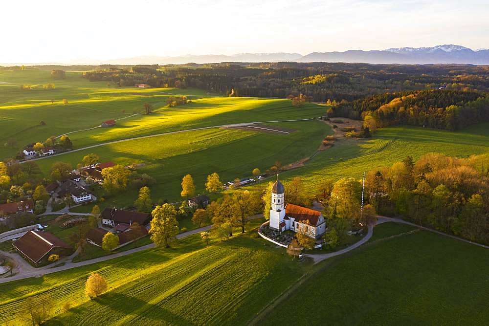 Holzhausen with St. Johann Baptist church in the morning light, Holzhausen near Muensing, Fuenfseenland, Upper Bavaria, Bavaria, Germany, Europe