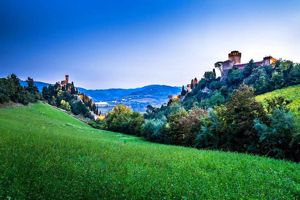 Clock tower Torre dell'Orologio and fortress Rocca Manfrediana at dusk, Brisighella, Emilia-Romagna, Italy, Europe