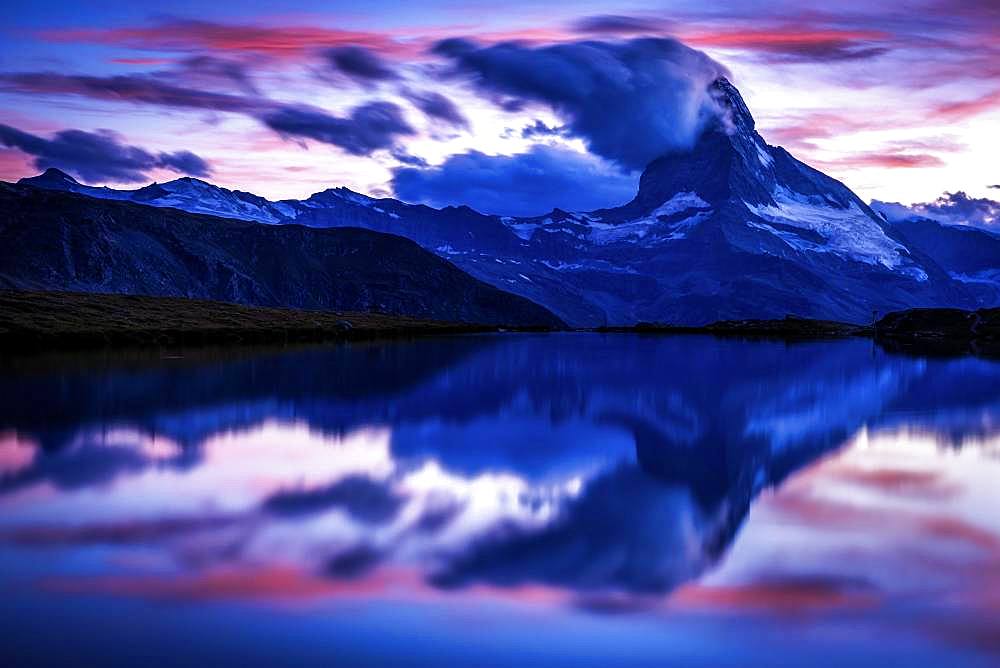 Matterhorn at sunset reflected in the Stellisee, Zermatt, Valais, Switzerland, Europe