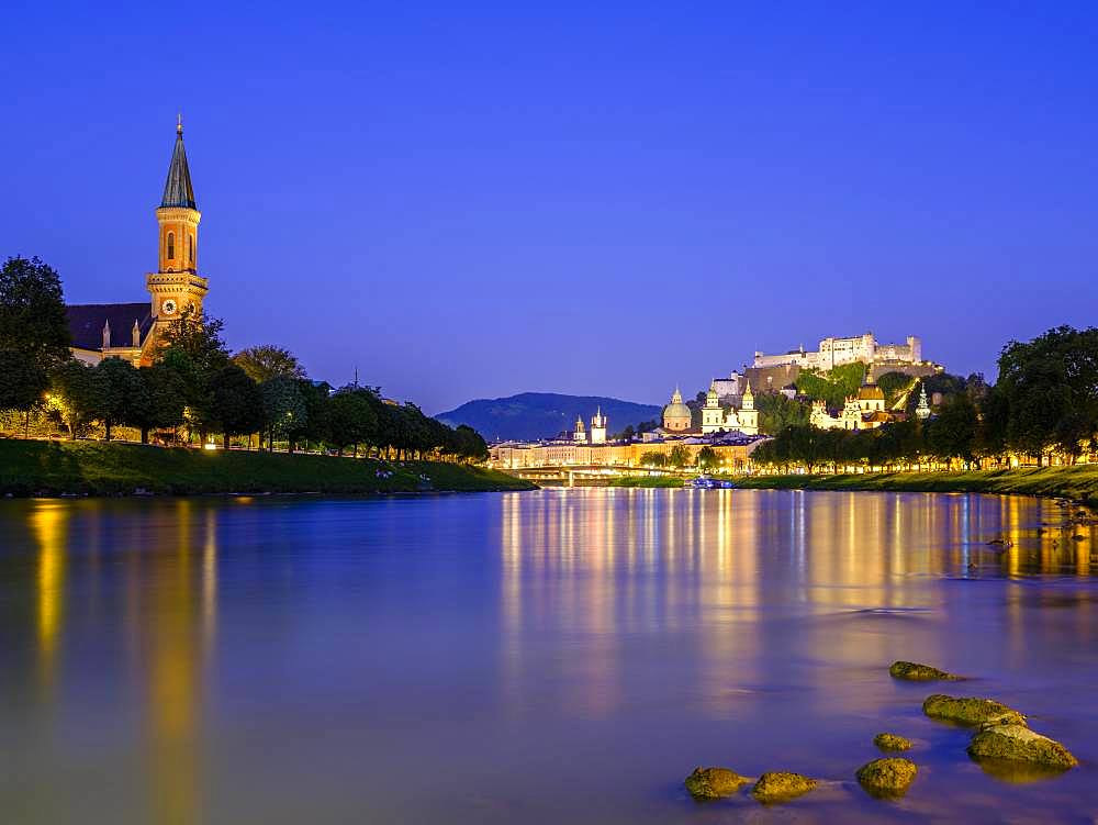 City view, old town and fortress Hohensalzburg over the river Salzach at dusk, Salzburg, Land Salzburg, Austria, Europe