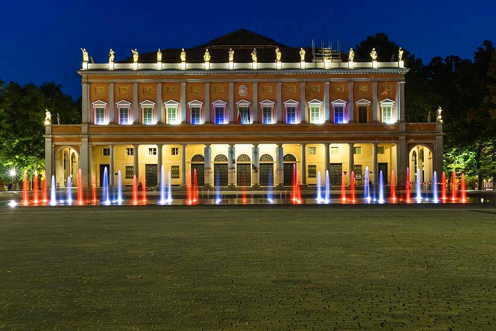 Illuminated fountain at the theater, Teatro Municipale also Teatro Municipale Valli, dusk, Reggio Emilia, Emilia-Romagna, Italy, Europe