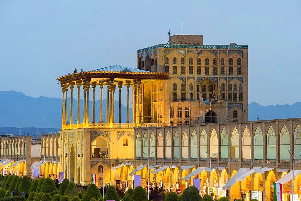 Illuminated Ali Qapu palace at dusk, Maydam-e Iman square, Esfahan, Iran, Asia