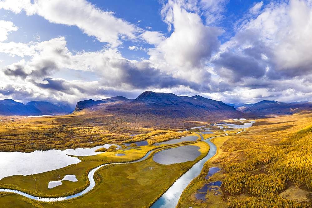 Autumn landscape with river, lakes and mountains, river Visttasjohka, Nikkaluokta, Lapland, Sweden, Europe