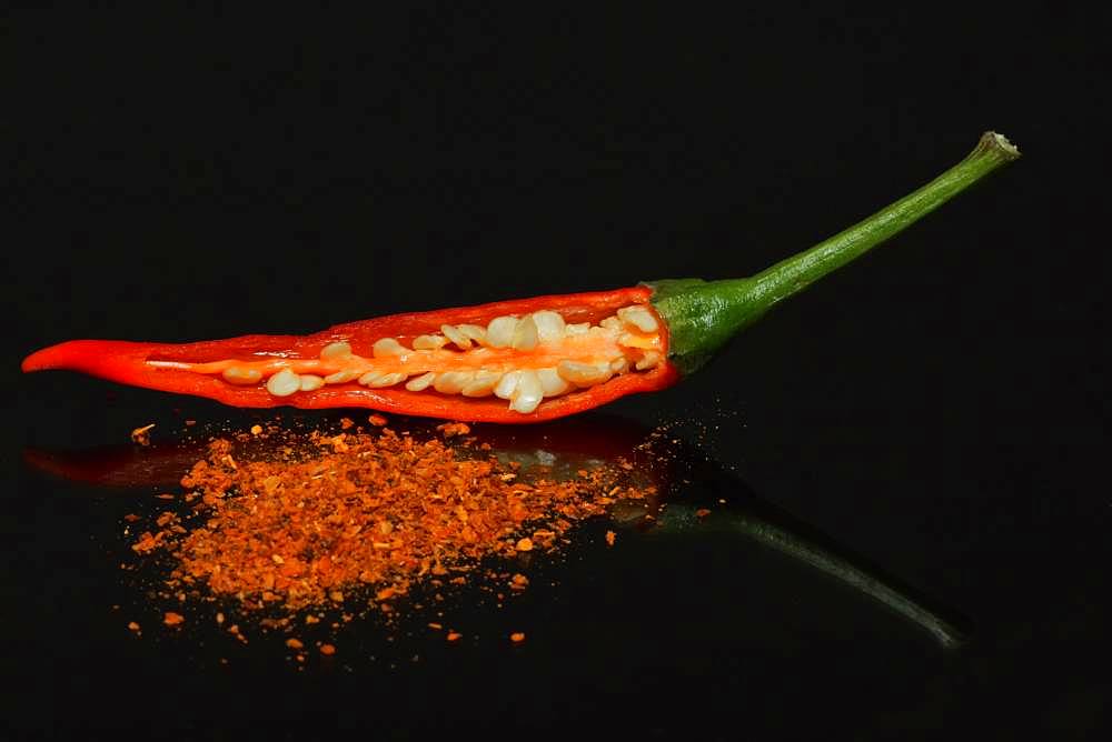 A halved fresh Thai red chili and dried chili powder, Berlin, Germany, Europe