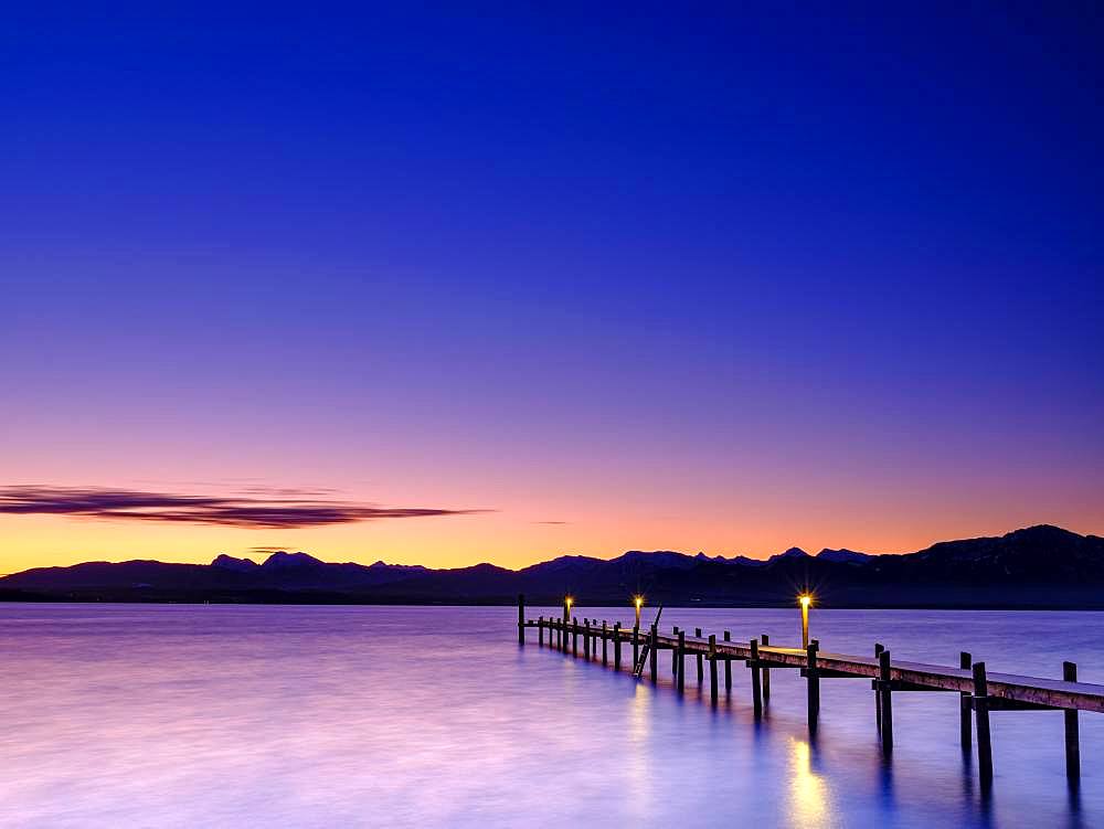 Footbridge at Chiemsee at dawn, behind the Chiemgau Alps, Chiemgau, Upper Bavaria, Bavaria, Germany, Europe