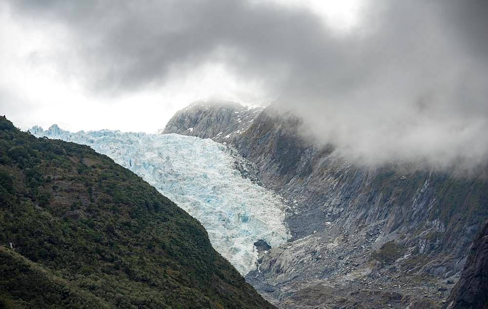 Tongue of Franz Josef Glacier, wrapped in clouds, West Coast, South Island, New Zealand, Oceania