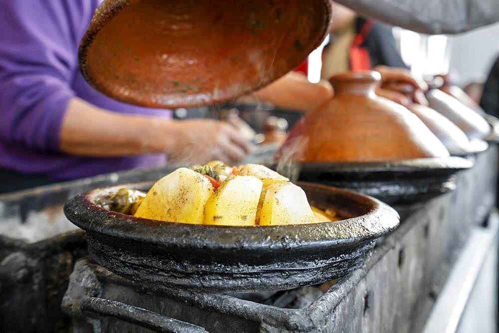 Delicious moroccan tajine prepared and served in clay pots, Marrakech