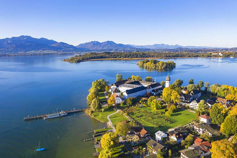 Steam jetty and Benedictine monastery Frauenwoerth on Fraueninsel, Frauenchiemsee, behind Krautinsel and Herreninsel, Chiemsee, Alps, Chiemgau, aerial view, foothills of the Alps, Upper Bavaria, Bavaria, Germany, Europe