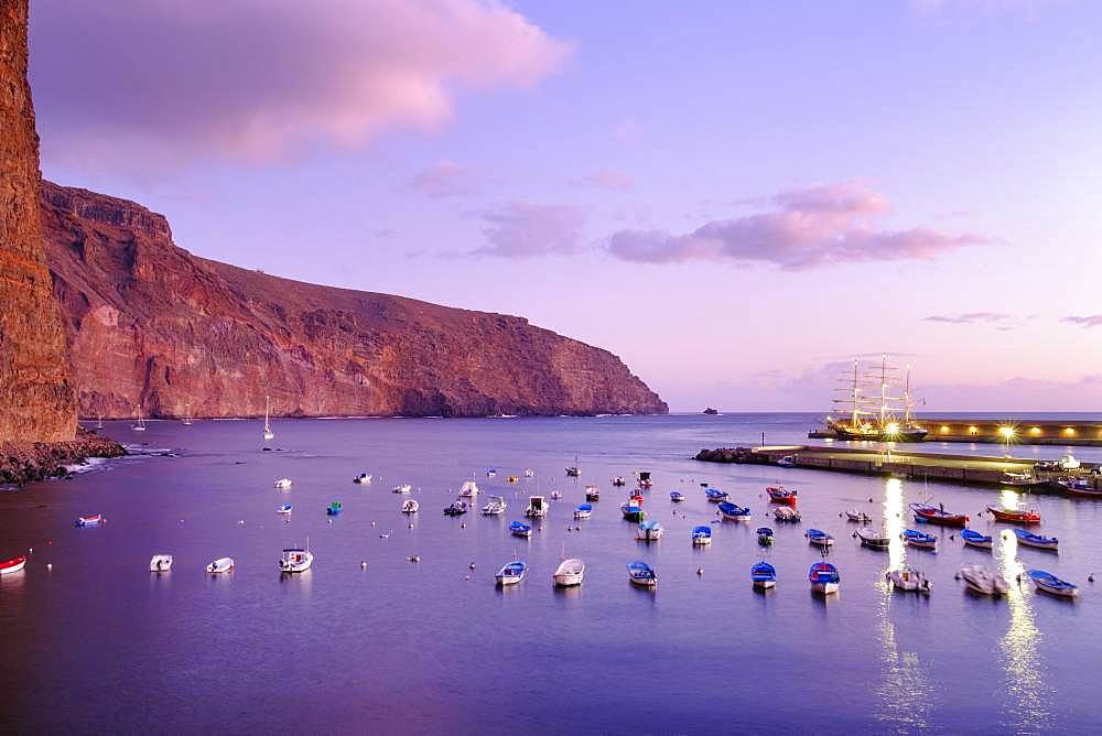 Fishing boats in the fishing port at dusk, Vueltas, Valle Gran Rey, La Gomera, Canary Islands, Spain, Europe