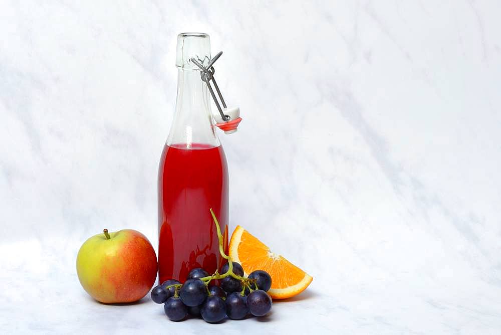 Fruit juice in bottle and fruit, Germany, Europe