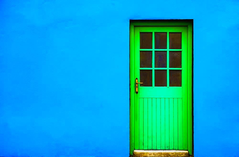 Blue house facade with green front door, Burren, West Coast, County Clare, Republic of Ireland