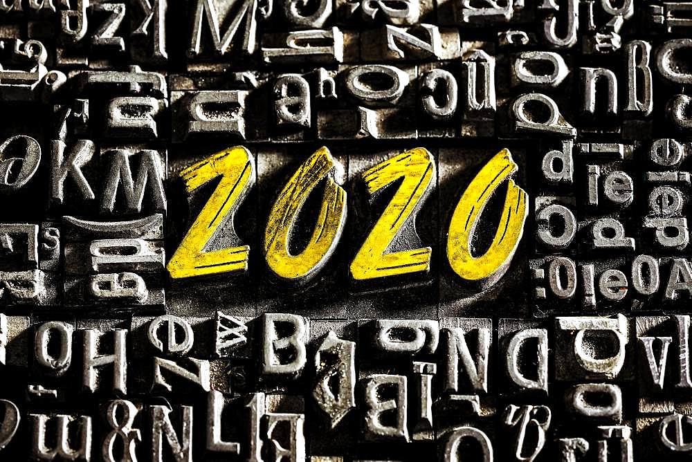 Old lead letters with golden writing show the word 2020, Germany, Europe