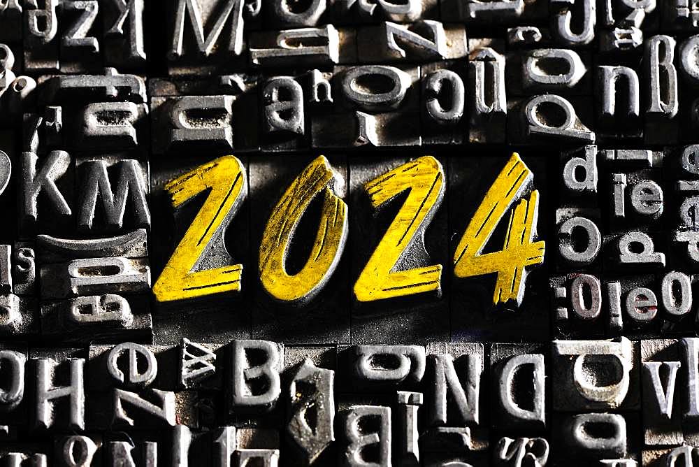 Old lead letters with golden writing show the word 2024, Germany, Europe