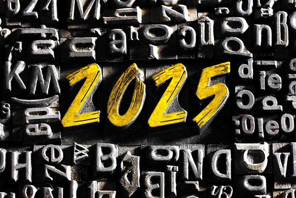 Old lead letters with golden writing show the word 2025, Germany, Europe