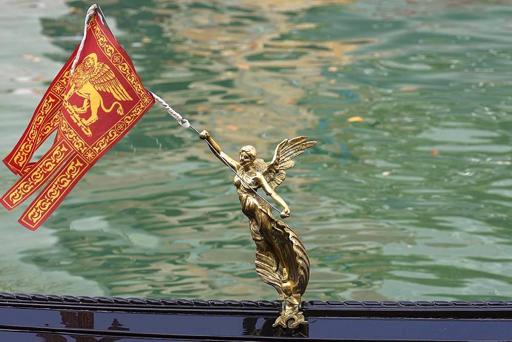 Angel figure with Venetian flag on a gondola, Venice, Veneto, Italy, Europe