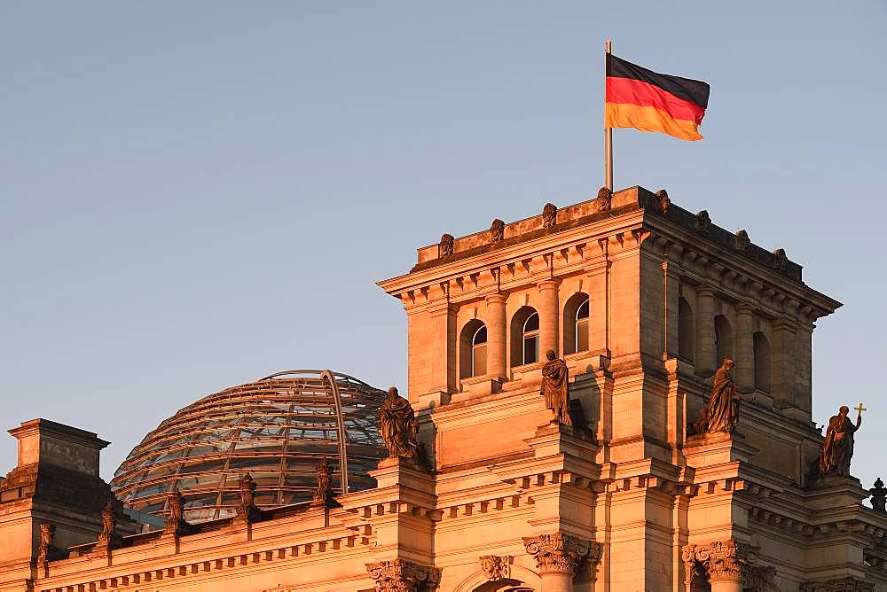 German flag on the Reichstag, in the first morning light, Berlin-Mitte, Berlin, Germany, Europe