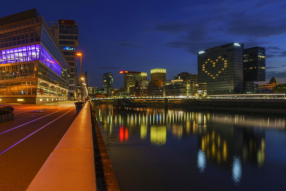 Hotel Hyatt Regency, illuminated with heart, reflection of the lights in the Rhine, closed during the Corona Pandemic, dusk, Media Harbour, Duesseldorf, North Rhine-Westphalia, Germany, Europe