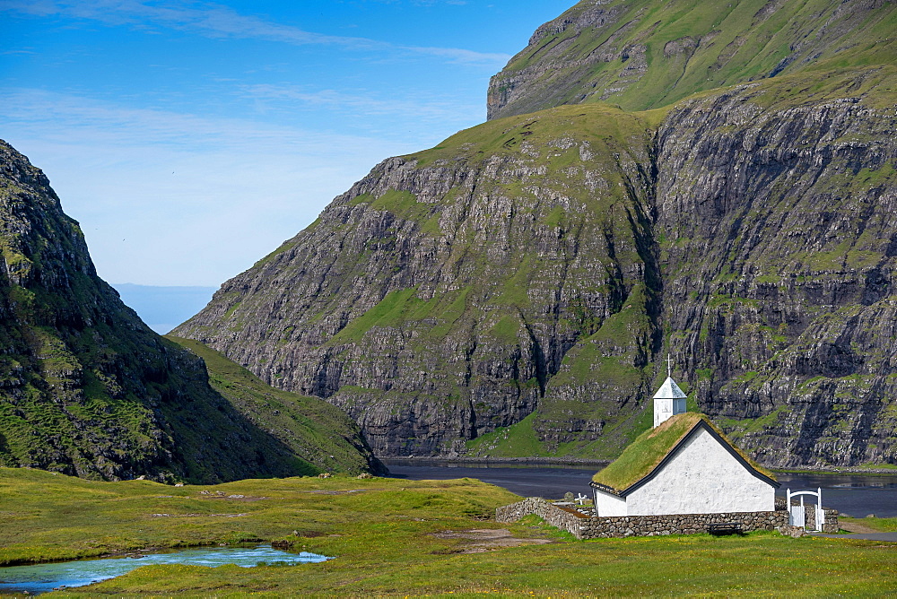 Small church with grass roof in mountain landscape, Saksun, Streymoy, Faroe Islands, Foroyar, Denmark, Europe