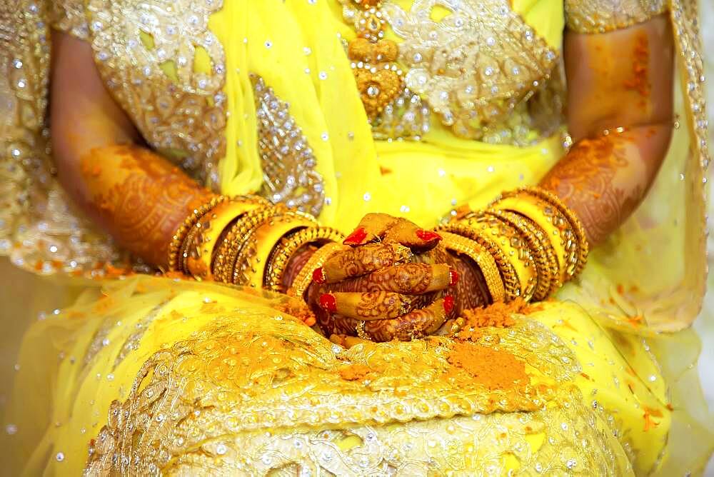 Hand of a bride painted with henna and fresh turmeric paste on the eve of the wedding, Beau Bassin, Mauritius, Africa