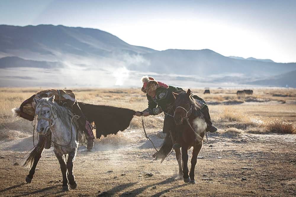 Spai Bashakhan's sons train for the Mongolian equestrian game Buzkaschi, Olgii Province, Mongolia, Asia