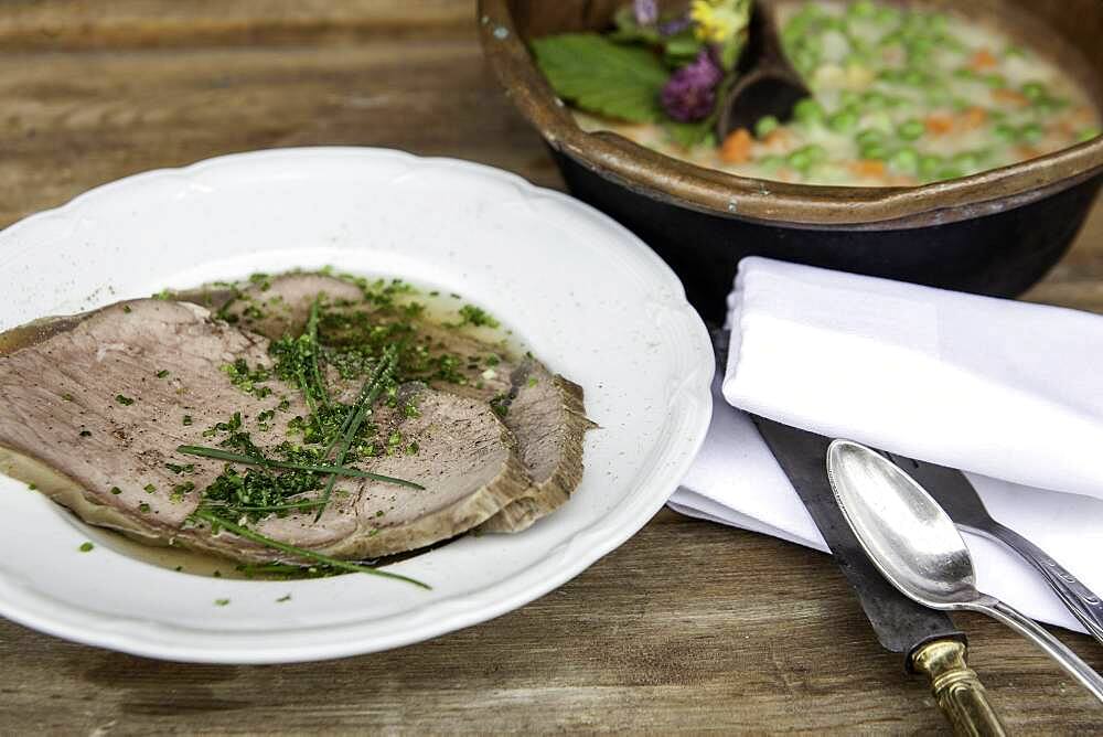 Boiled boiled beef with beef soup and chives, peas and carrots as creamy vegetables, Rauris, Pinzgau, Salzburger Land, Austria, Europe