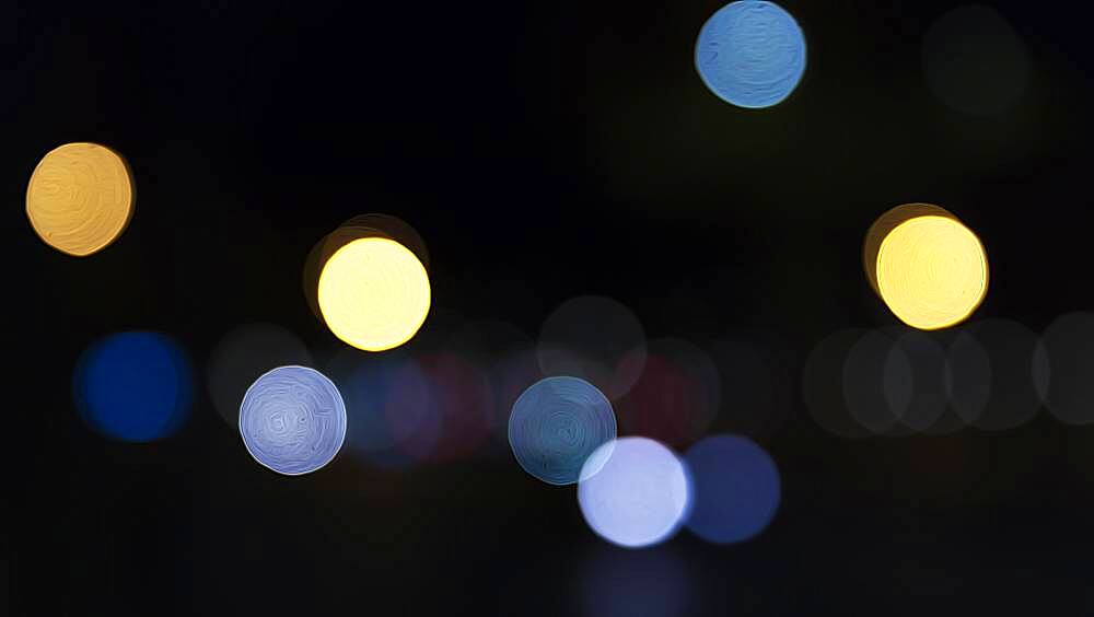 Abstract dark background with sparkling yellow and blue lights, Barcelona, Spain, Europe