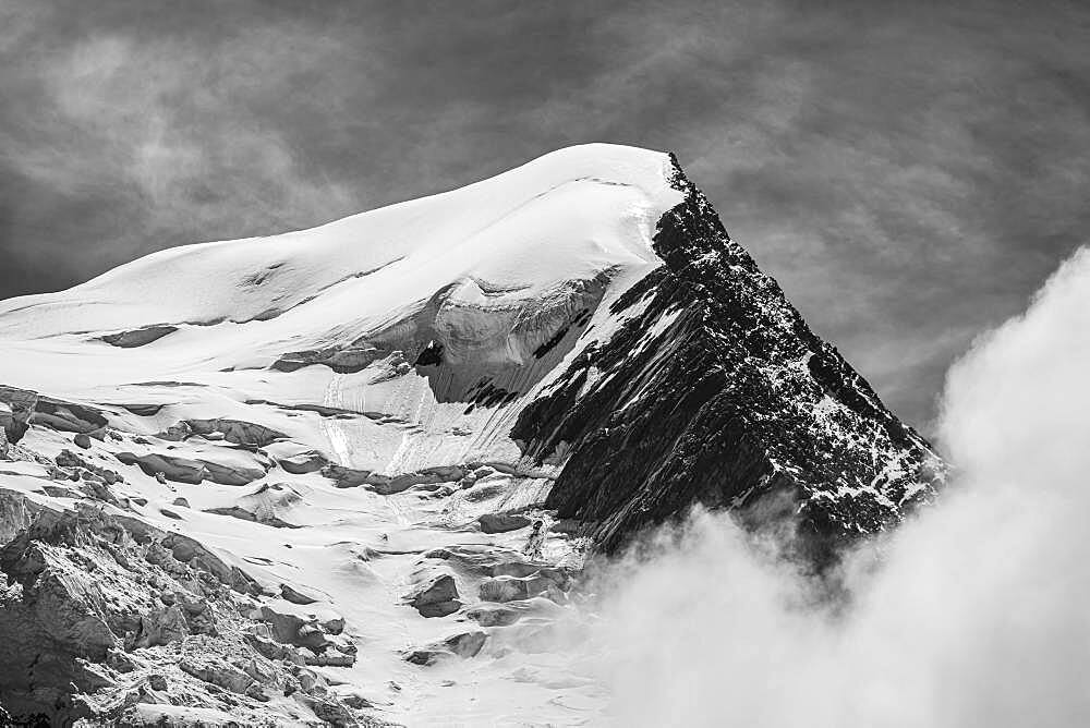 Black and white, high alpine mountain landscape, peak Aiguille du Gouter with glacier, Glacier de Taconnaz, behind Mont Blanc, Chamonix, Haute-Savoie, France, Europe