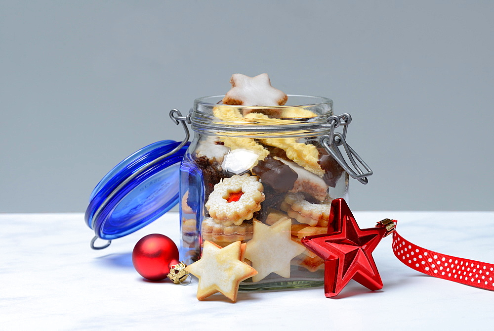 Glass container with Christmas cookies, Germany, Europe