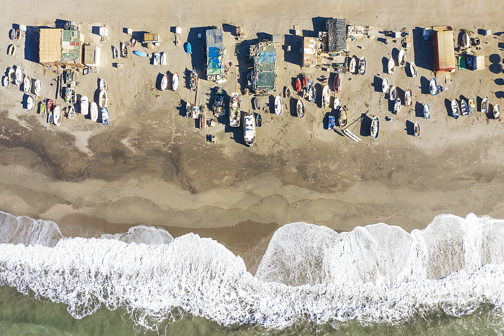 Fishing boats and fishermen cottages at the beach of San Miguel de Cabo de Gata, aerial view, drone shot, Nature Reserve Cabo de Gata-Nijar, Almeria province, Andalusia, Spain, Europe