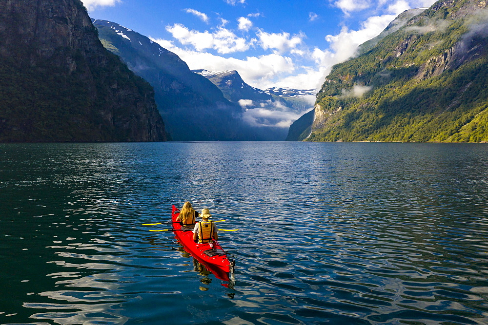 Red kayak in Geirangerfjord, near Geiranger, More og Romsdal, Norway, Europe