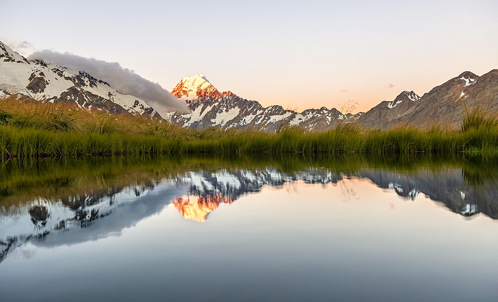 Mount Cook at sunset, reflection in mountain lake, Sealy Tarns, Hooker Valley, Mount Cook National Park, Southern Alps, Canterbury, South Island, New Zealand, Oceania