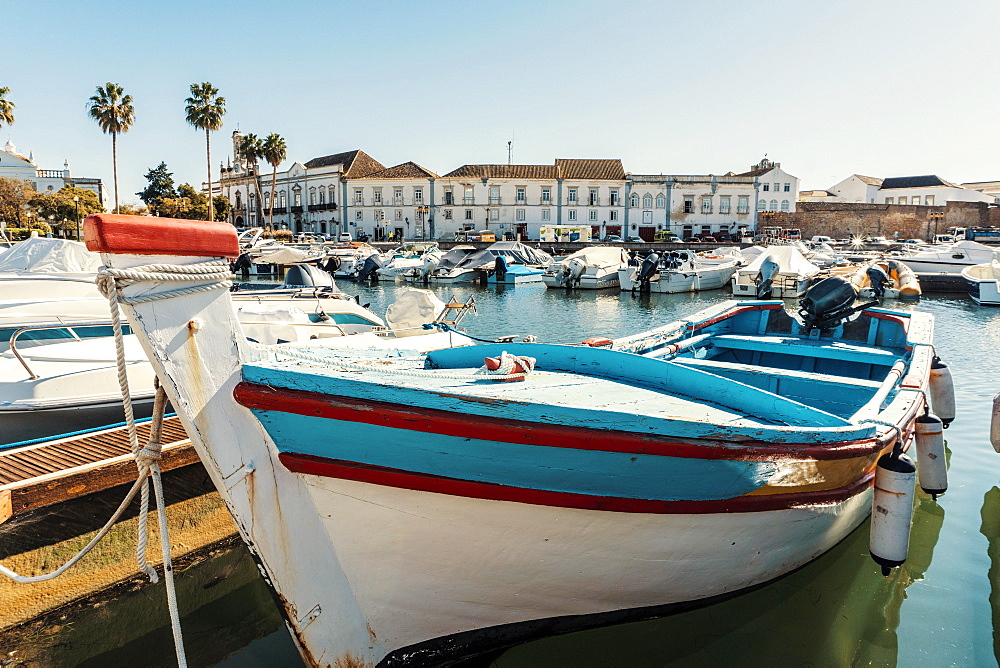 Old town of Faro with traditional wooden boat moored in marina, Algarve, Portugal, Europe