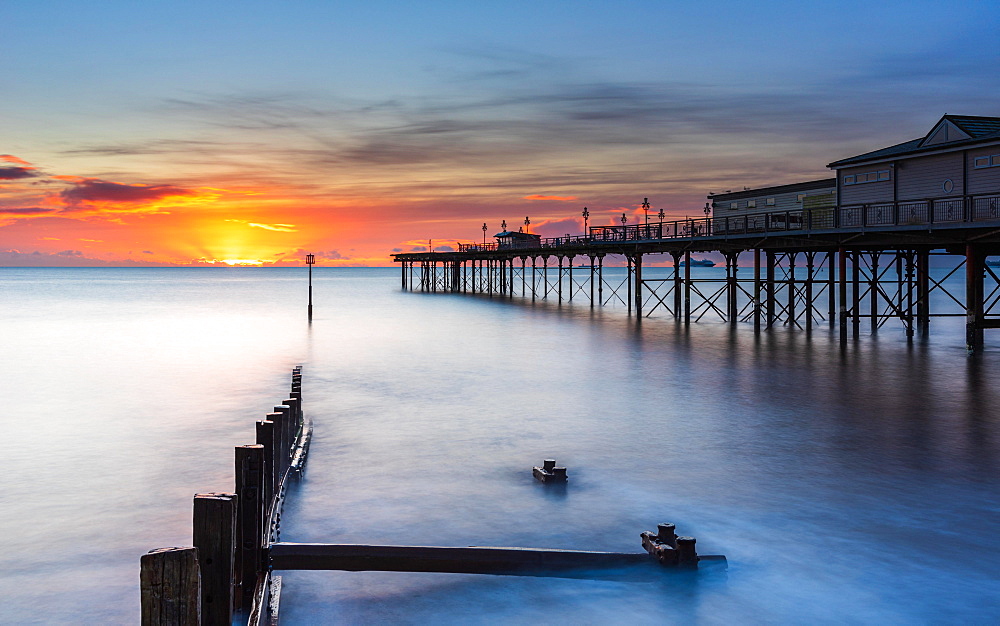 Sunrise in long time exposure of Grand Pier, Teignmouth, Devon, England, United Kingdom, Europe