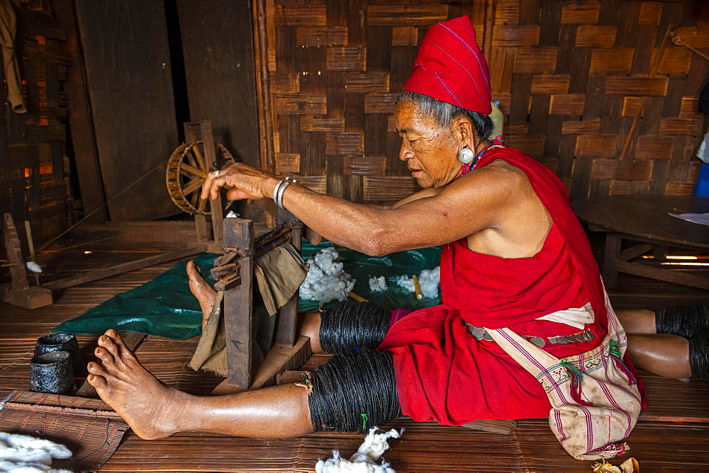 Old Kayan women weaving the traditional way, Kayah village, Loikaw area, Kayah state, Myanmar, Asia