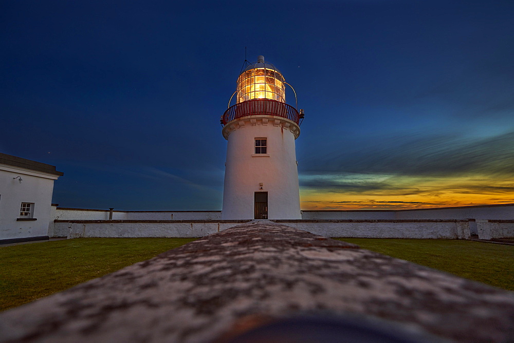 St. John`s Point lighthouse at dusk, with luminous light on, St. John`s Point, County Donegal, Ireland, Europe