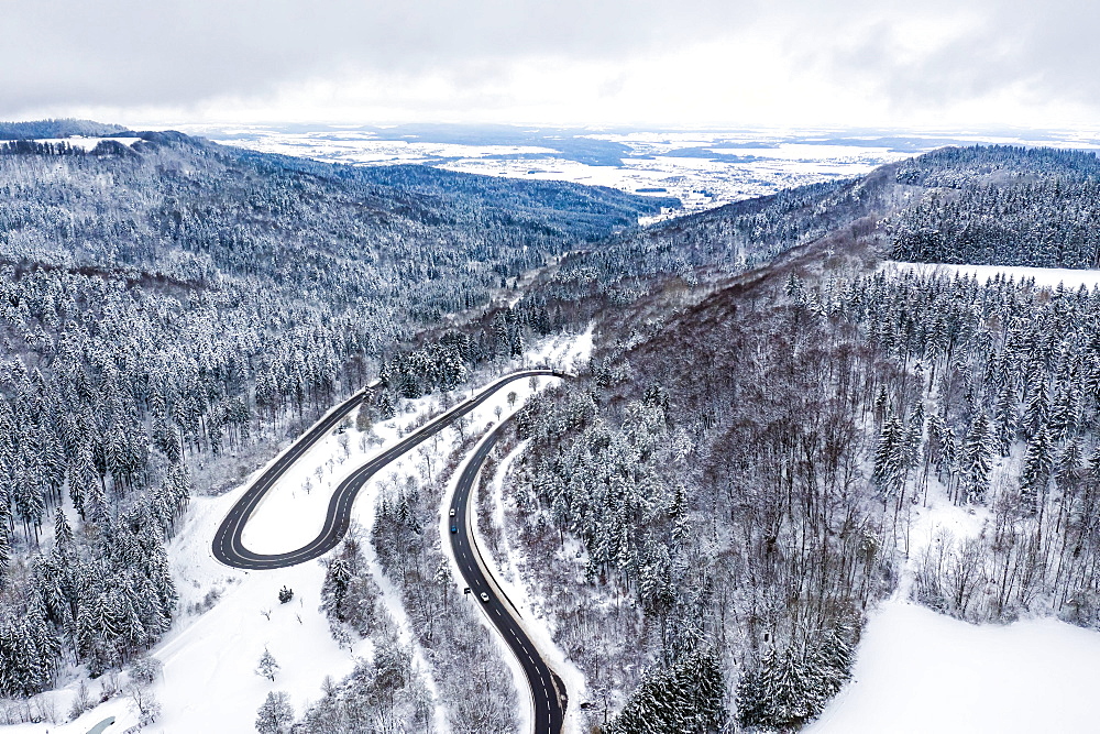 Winter snow road serpentine curves aerial photo near Albstadt curve, Germany, Europe