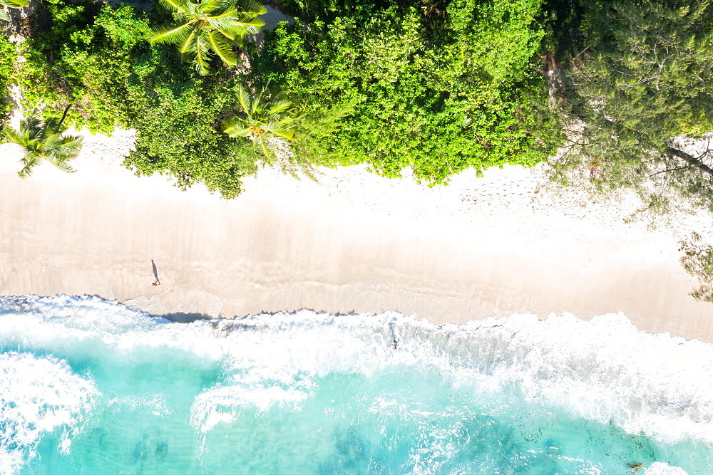 Takamaka beach sea holiday waves ocean drone shot bird's eye view, Mahe, Seychelles, Africa