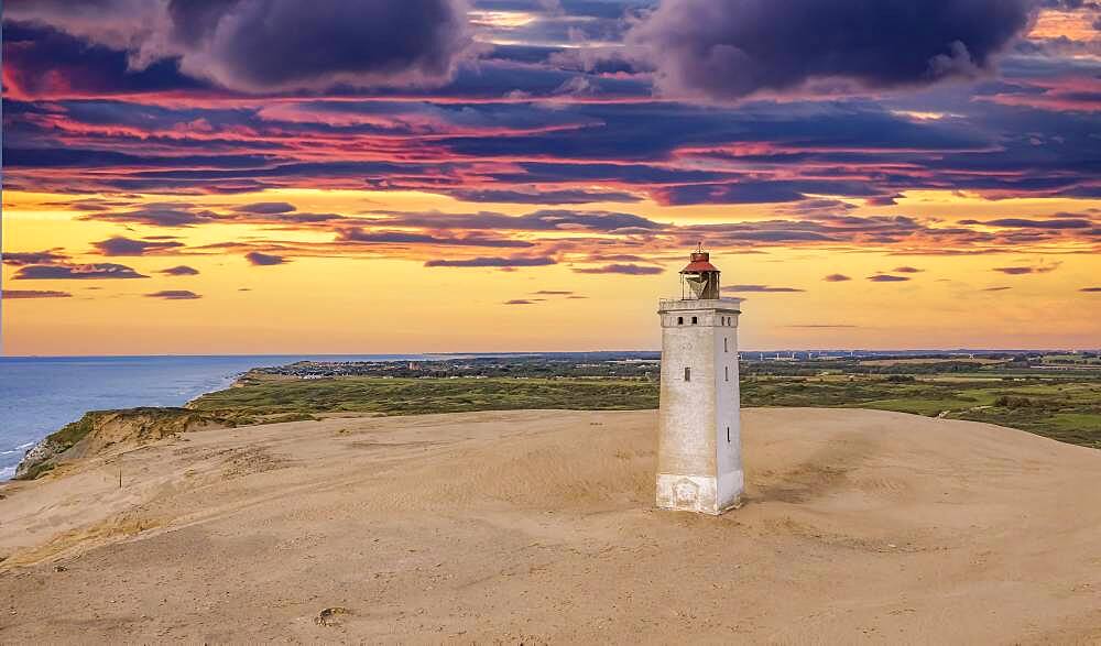 Sunset at Rubjerg Knude Fyr lighthouse, aerial view, North Jutland, Denmark, Europe