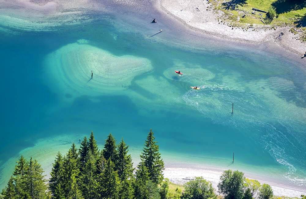 People on a stand-up paddle and kayak on the shore of Plansee, Reutte, Tyrol, Austria, Europe