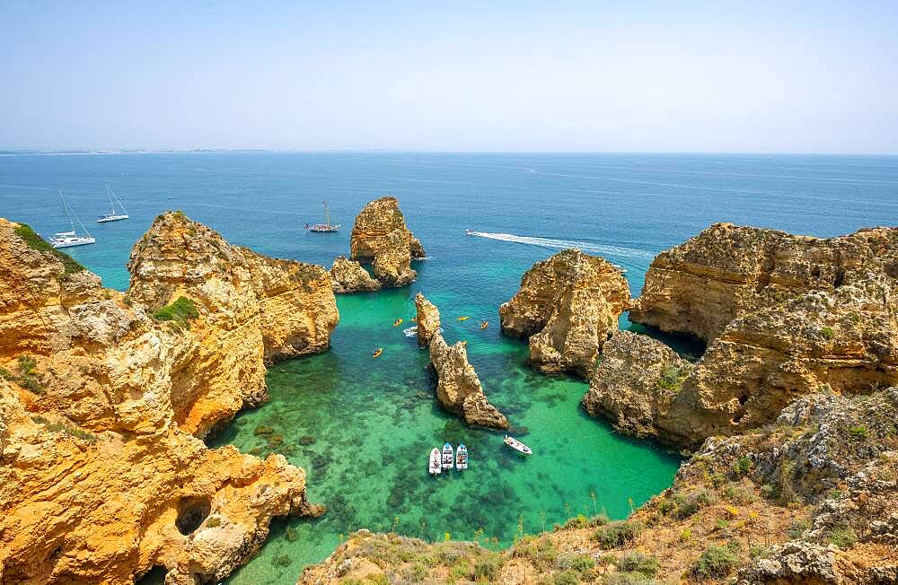 Rugged rocky coast with cliffs of sandstone, rock formations in the sea, Ponta da Piedade, Algarve, Lagos, Portugal, Europe