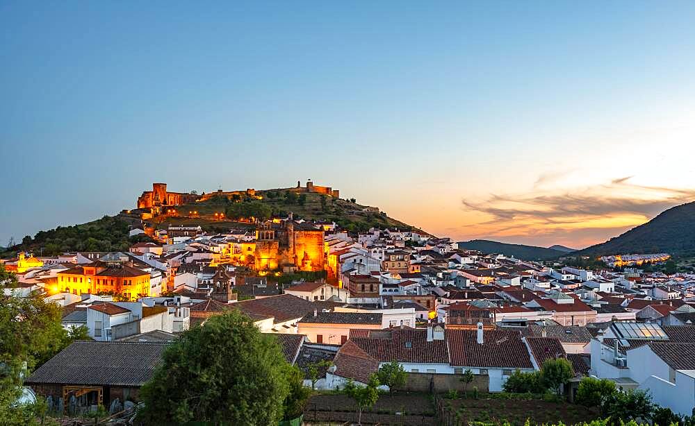 Town view of the village Aracena with illuminated fortress Castillo de Aracena, evening mood, Aracena, Huelva, Spain, Europe