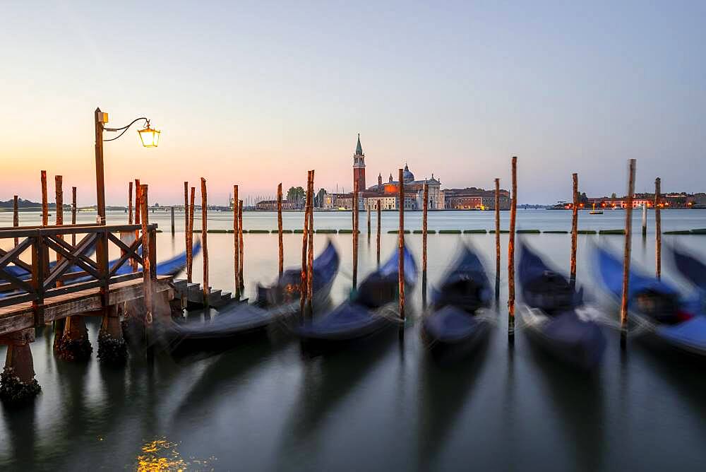 Boat landing stage, jetty with Venetian gondolas, in the back church San Giorgio Maggiore, long exposure, dawn, Venice, Veneto, Italy, Europe