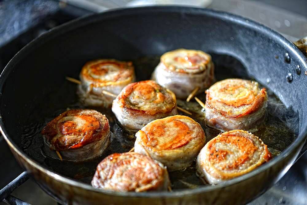 Pieces of pork tenderloin fried in a pan