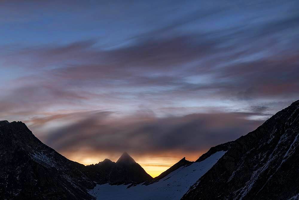 Mountain ridge at sunrise with dramatic clouds, Soelden, Oetztal, Tyrol, Austria, Europe