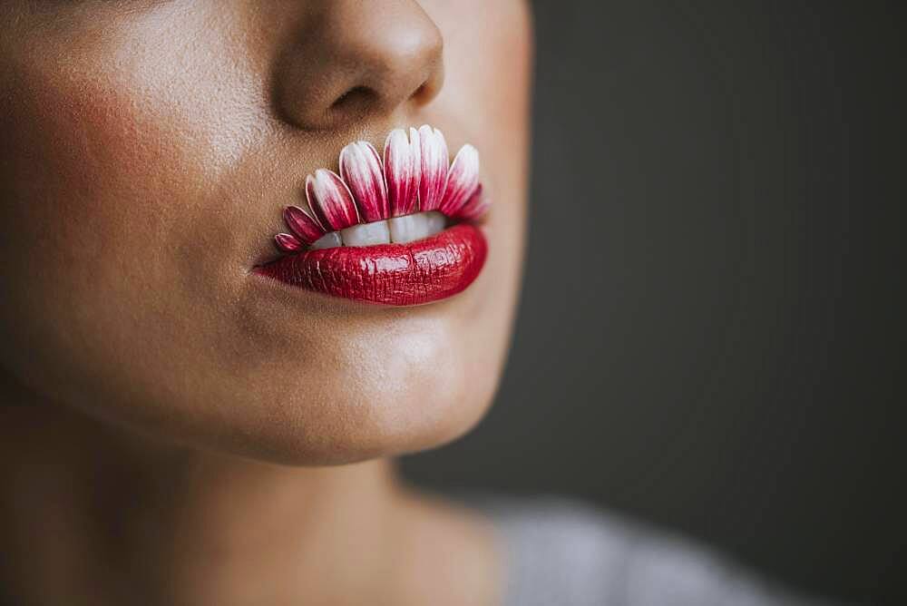 Young woman with flower lips