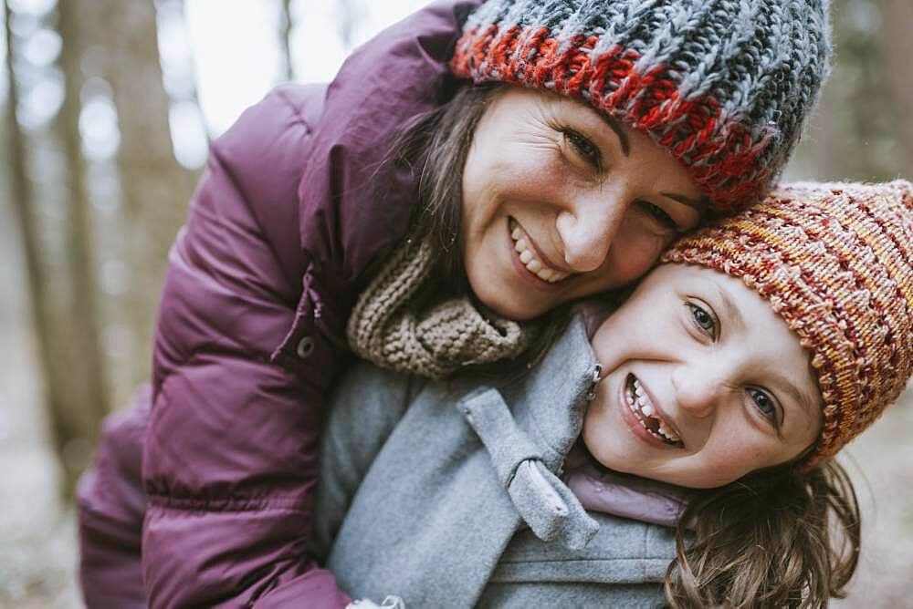 Mother and daughter in the forest