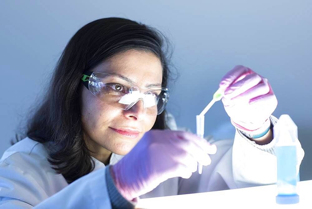 Middle aged technician in laboratory with lab coat, Freiburg, Baden-Wuerttemberg, Germany, Europe