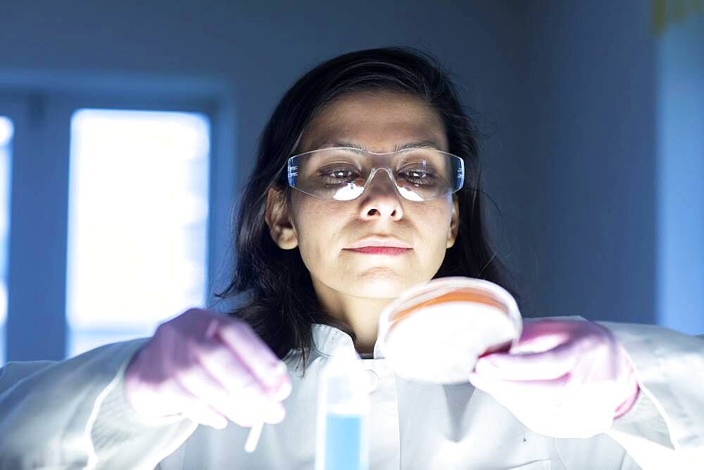 Middle aged technician in laboratory with lab coat, Freiburg, Baden-Wuerttemberg, Germany, Europe