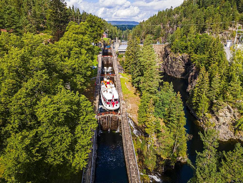 Aerial of a tourist boat in the Vrangfoss lock, Telemark Canal, Norway, Europe