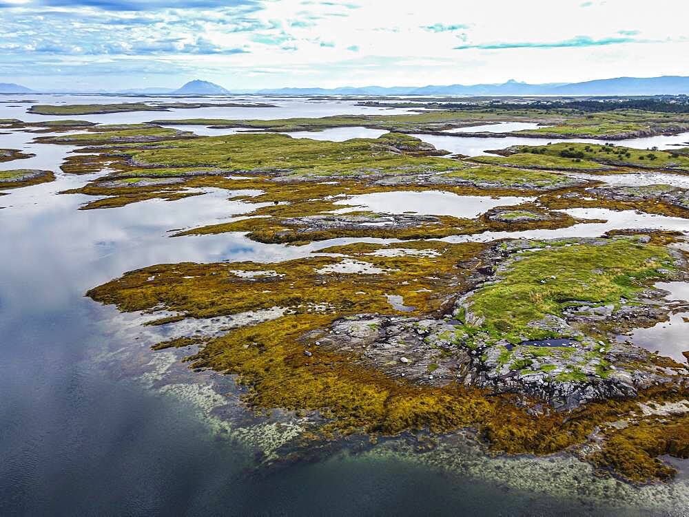 Aerial of the rugged coastline of the Unesco world heritage site, the Vega Archipelago, Norway, Europe